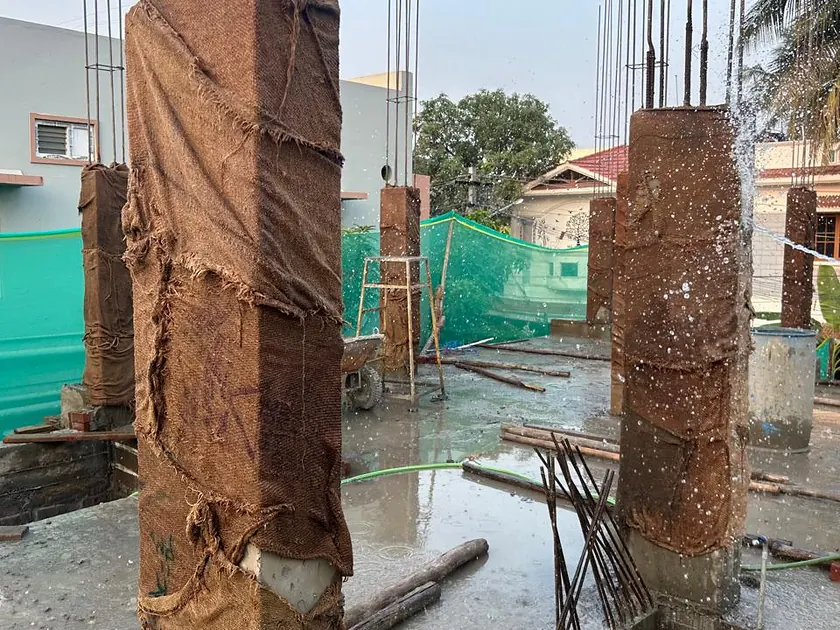 Cast columns wrapped in hessian and kept damp during curing