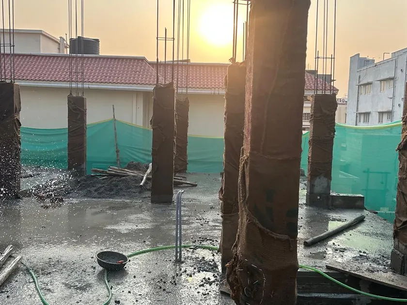 Ground floor columns cast and stripped, photographed at sunset