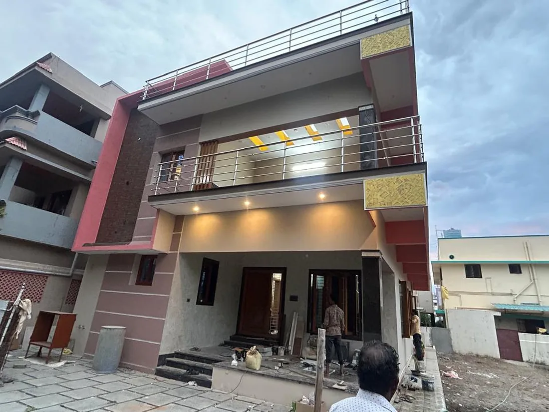 Two-storey residence nearing completion: cantilevered balcony, covered car porch and finished façade
